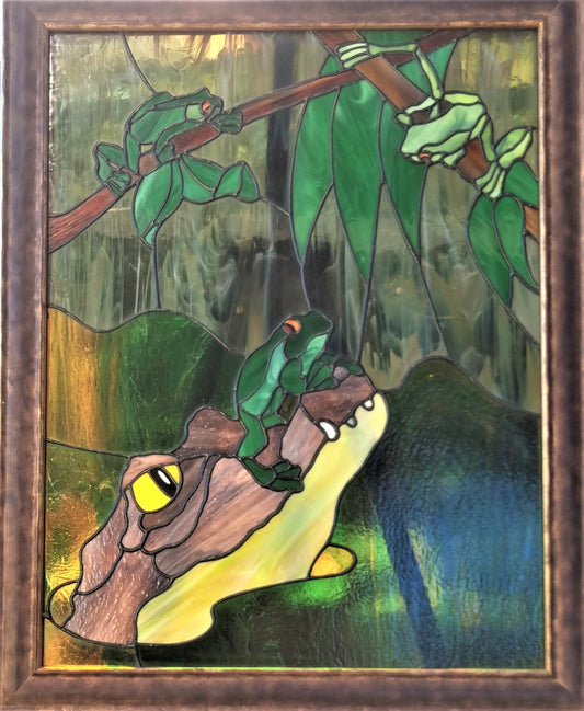 Croc contemplates his next move while the frogs frolic and continue their story of how the croc meet his match down in the great Billabong